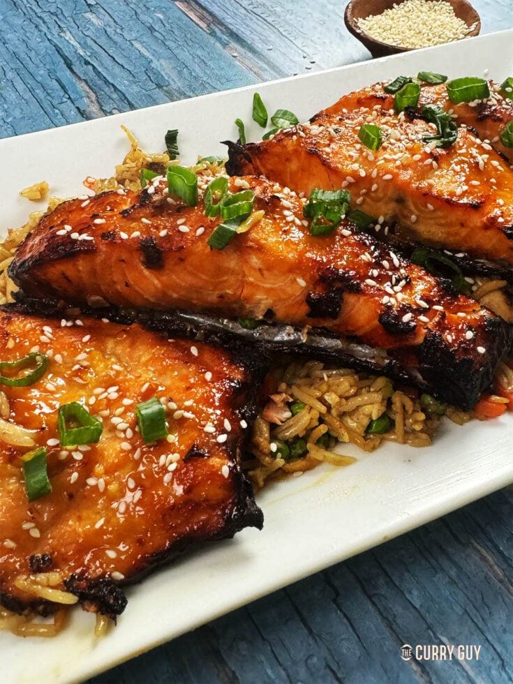 Miso salmon served on a bed of fried rice.