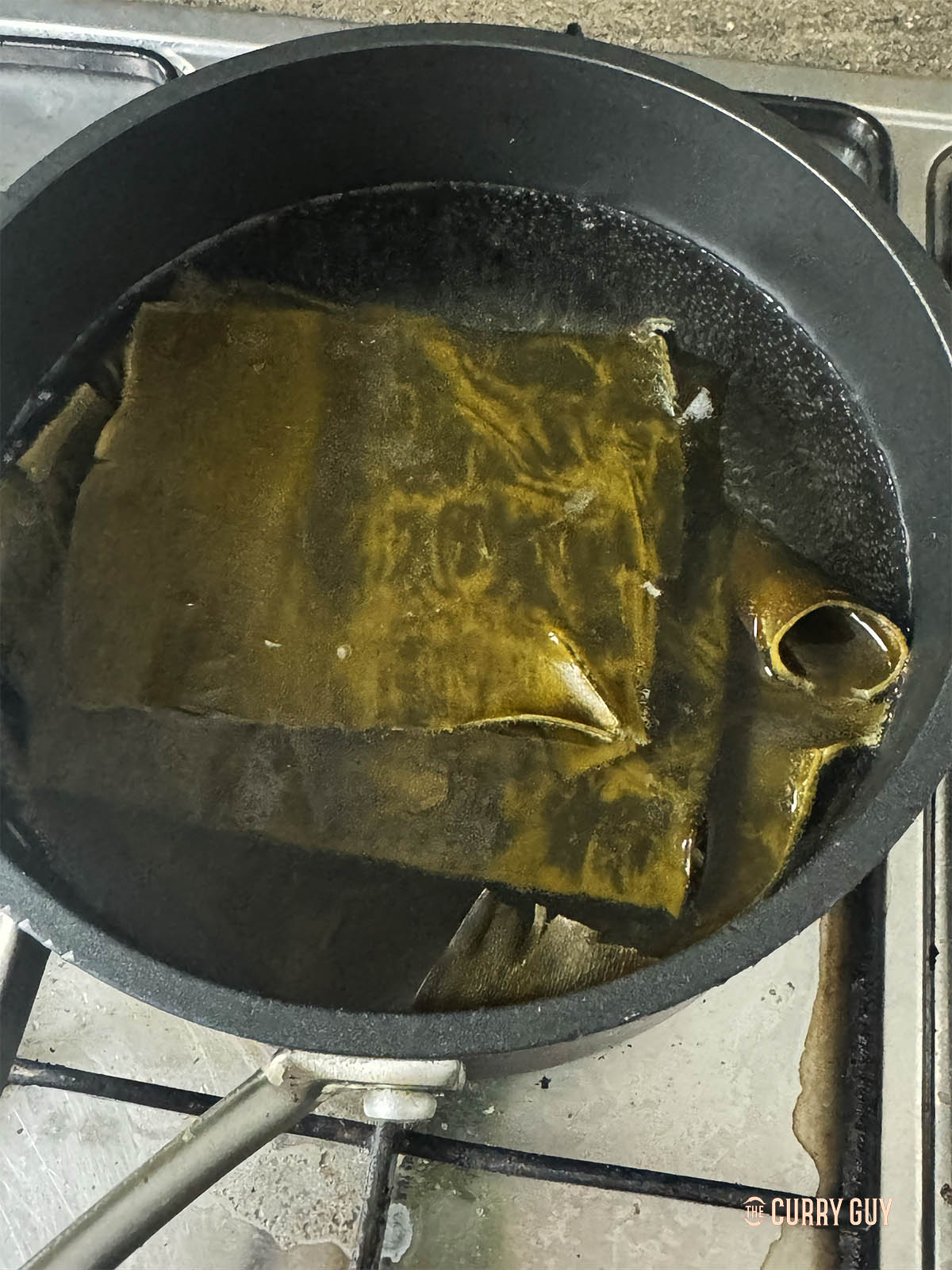 Simmering the kombu in the pan.