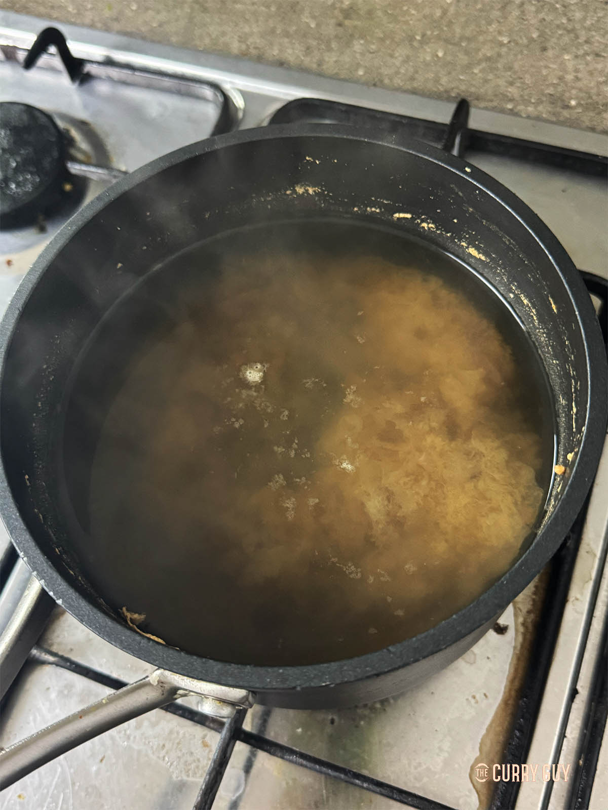 The bonito flakes at the bottom of the pan.