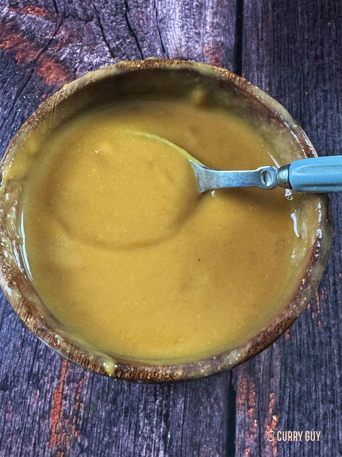 Whisking the miso paste with a little water until smooth. 