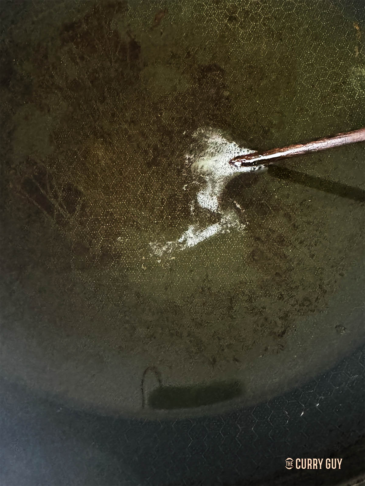 Test the heat of the oil with a wooden chopstick.