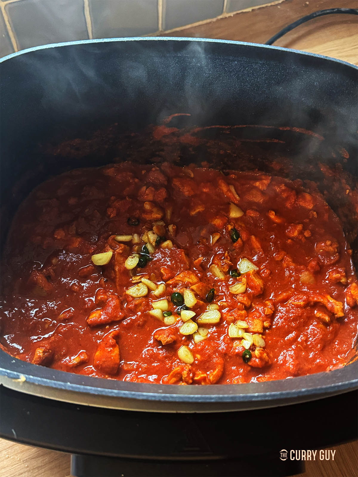 Slowly. Cooking the curry in the slow cooker. 