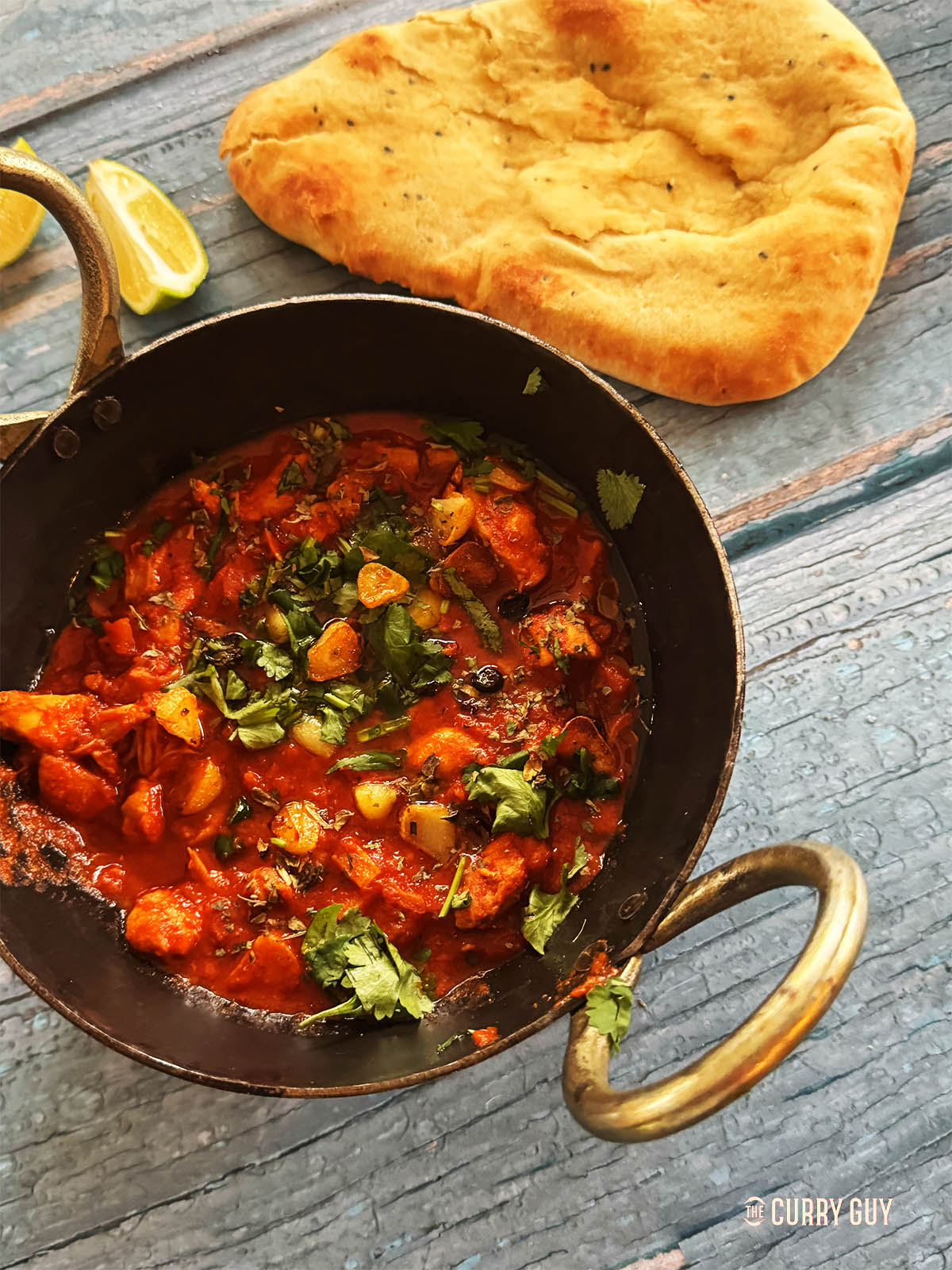 Finished slow cooker chicken chilli garlic curry, seasoned with salt to taste and lime juice.